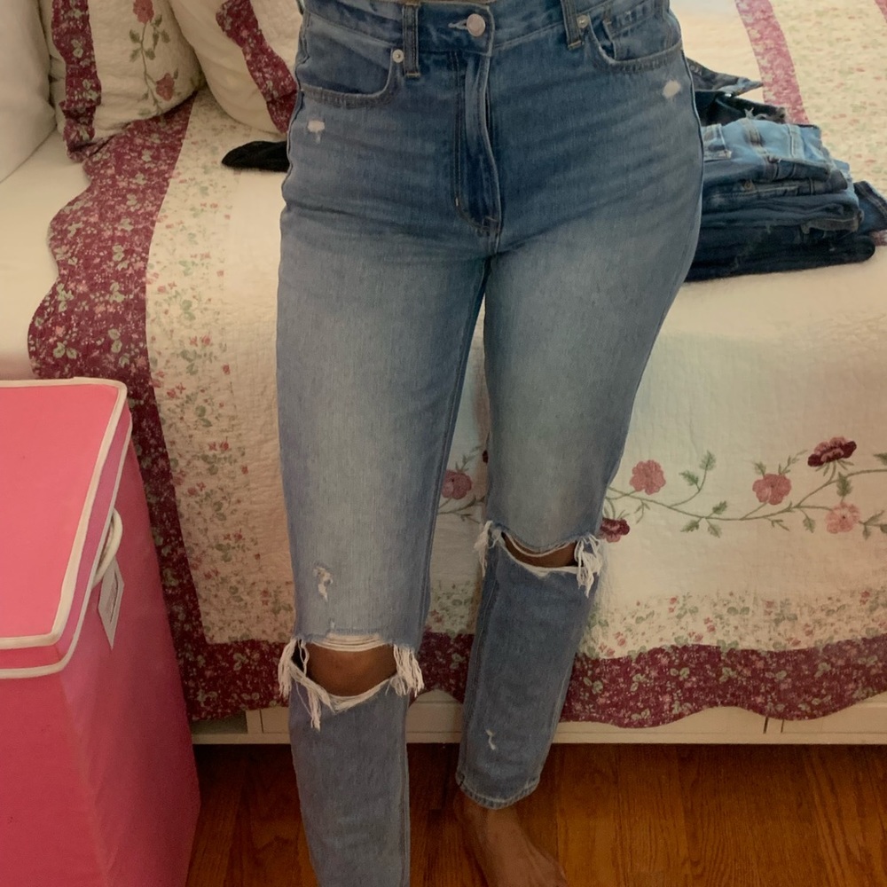 Mom jeans with rips in the knee